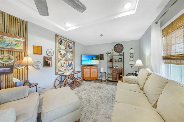 a living room with furniture a couch and a window