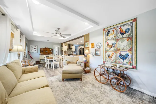 a living room with furniture a couch and dresser