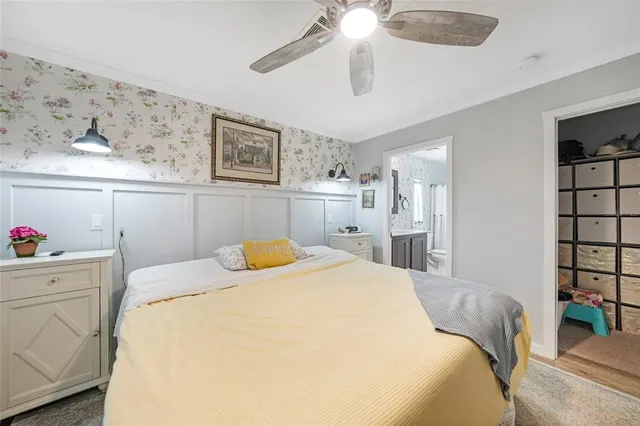a bathroom with a sink vanity mirror and toilet