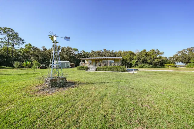 a backyard of a house with lots of green space