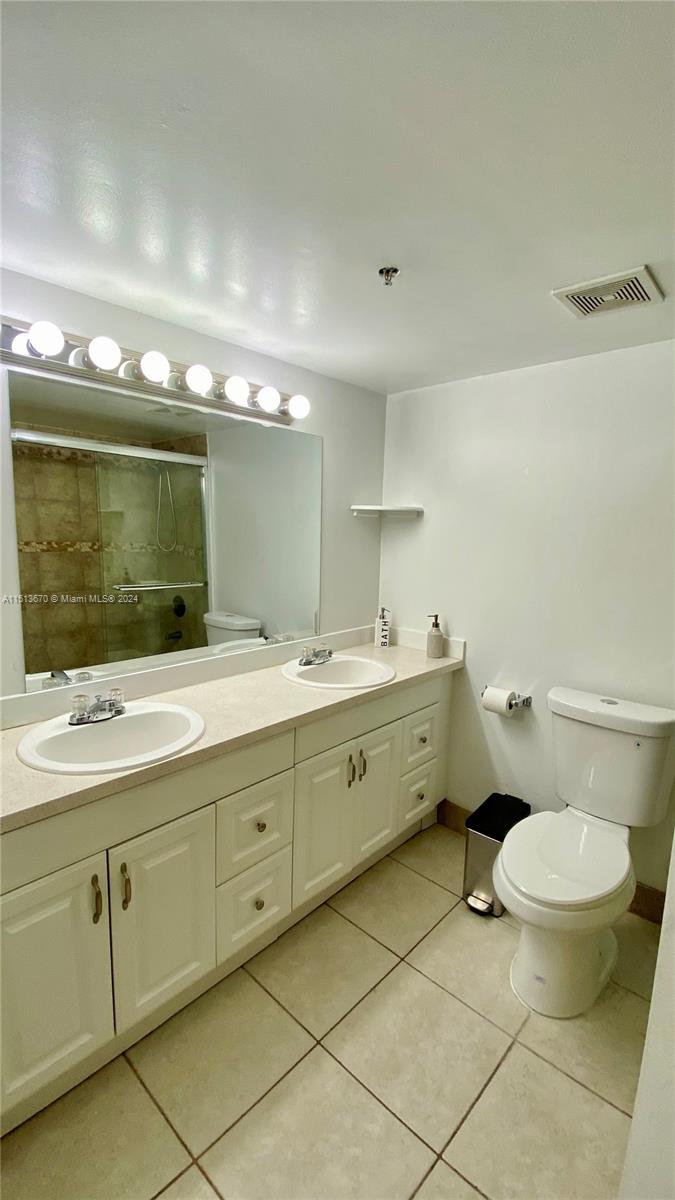 460 South Park Road, Unit 6103 Hollywood, FL 33021 - Photo 11 of 15 a bathroom with a double vanity sink mirror and toilet