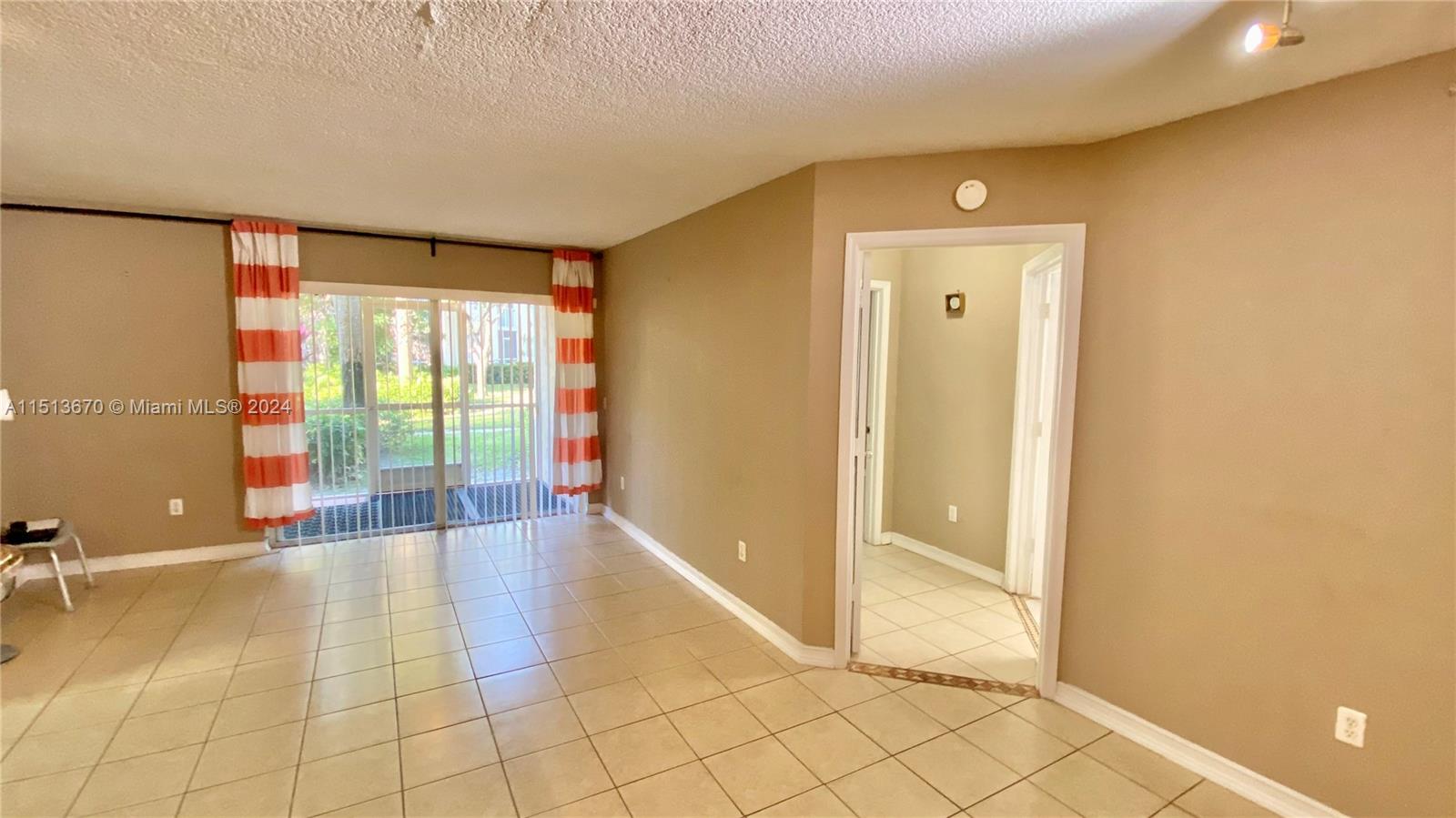 460 South Park Road, Unit 6103 Hollywood, FL 33021 - Photo 6 of 15 a view of an empty room with glass door