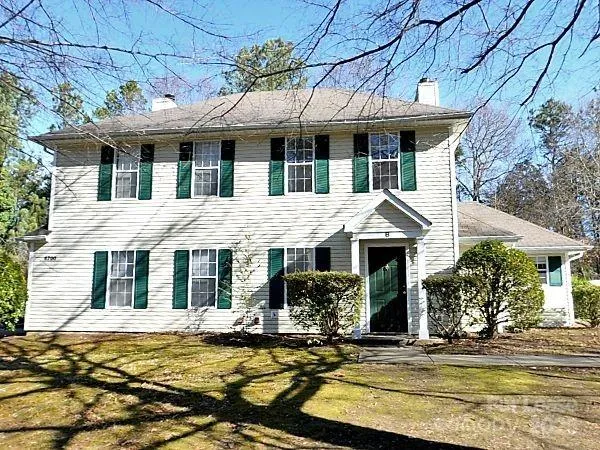a front view of a house with swimming pool