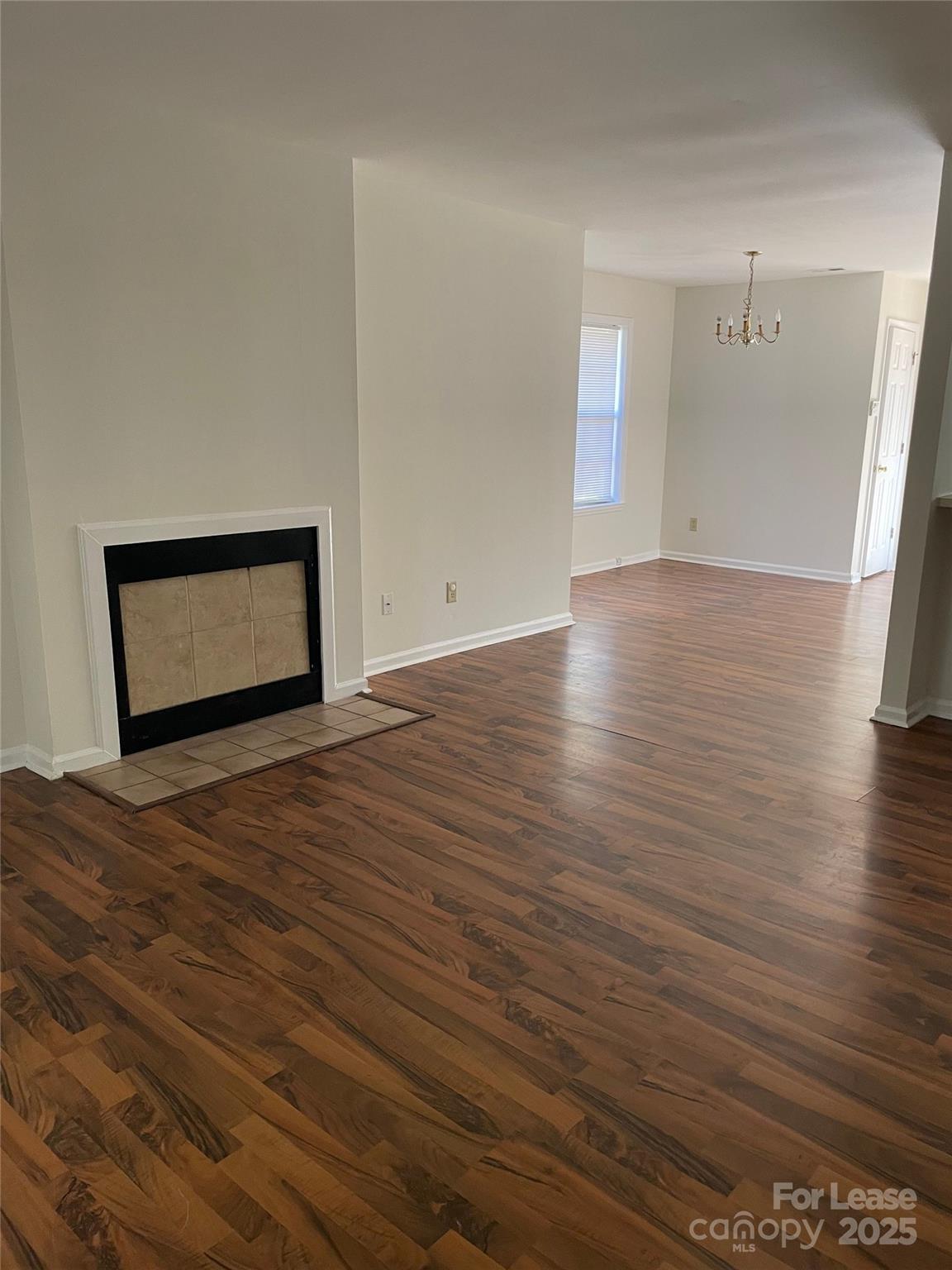 6700 Bevington Ridge Road Charlotte, NC 28277 - Photo 2 of 7 a view of an empty room and wooden floor