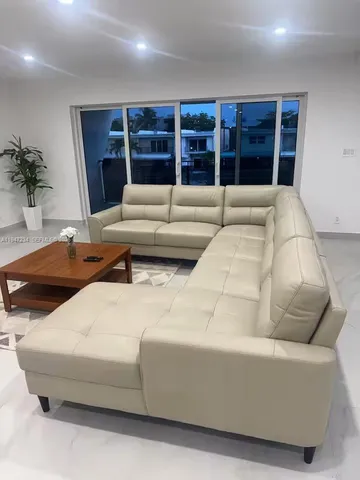 a living room with furniture and window