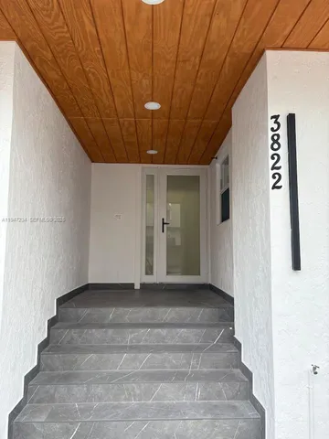 a front view of a building with a lot of windows