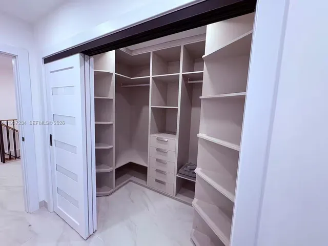 a view of an empty walk in closet