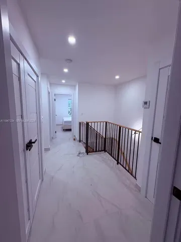 a view of a hallway with closet area