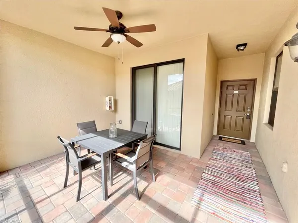 a view of a livingroom with furniture and a ceiling fan