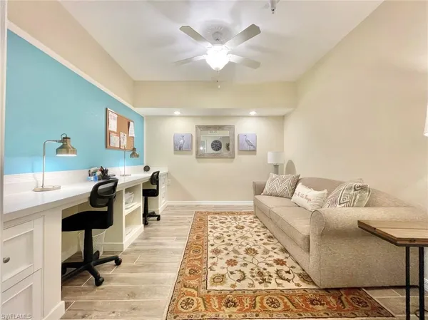 a living room with furniture and a rug