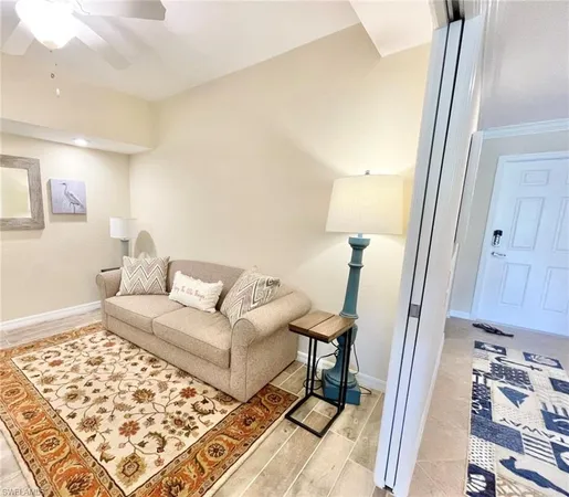 a living room with a couch and a rug