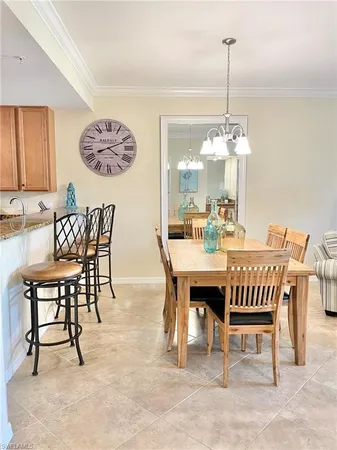 a view of a dining room and chandelier