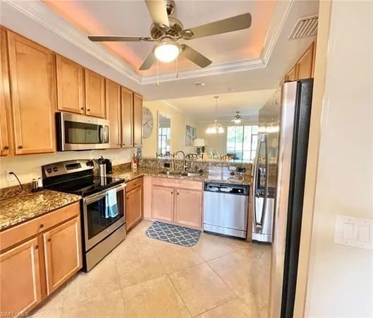 a kitchen with a stove a sink and a microwave