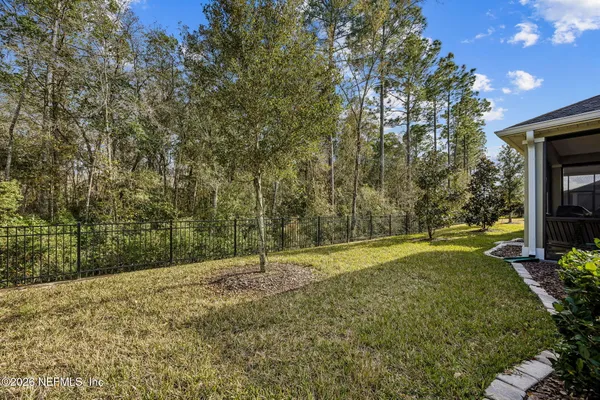 a front view of house with a garden