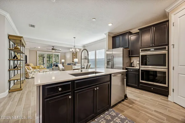 a kitchen with a refrigerator and a more cabinets