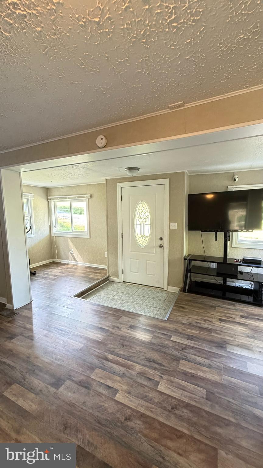 45 Figgins Road Front Royal, VA 22630 - Photo 3 of 17 a view of empty room with wooden floor and window