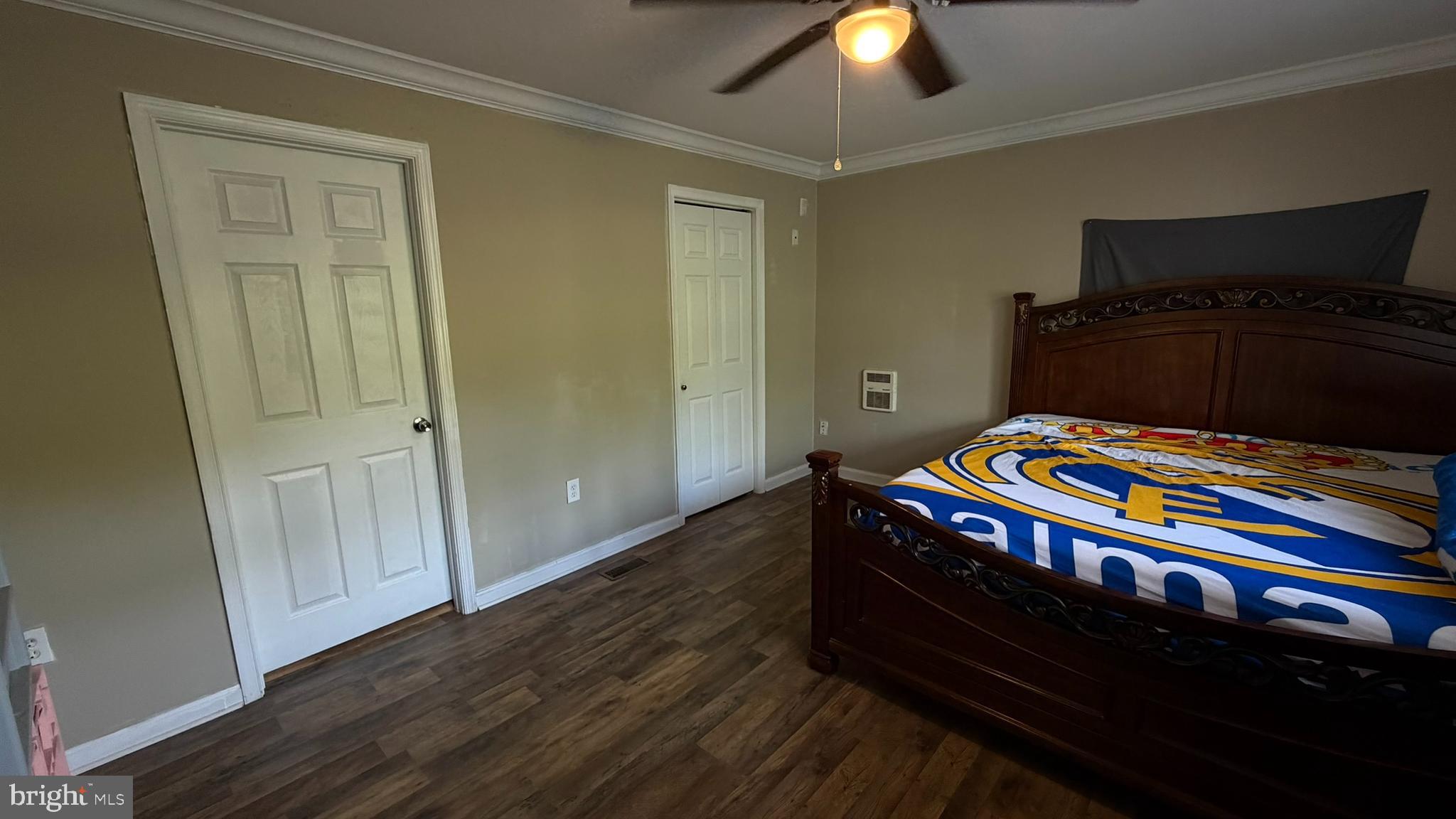 45 Figgins Road Front Royal, VA 22630 - Photo 7 of 17 a bedroom with a bed and a chandelier