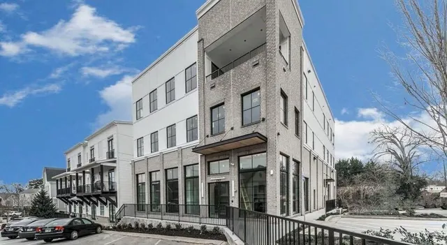 a view of a building with a street