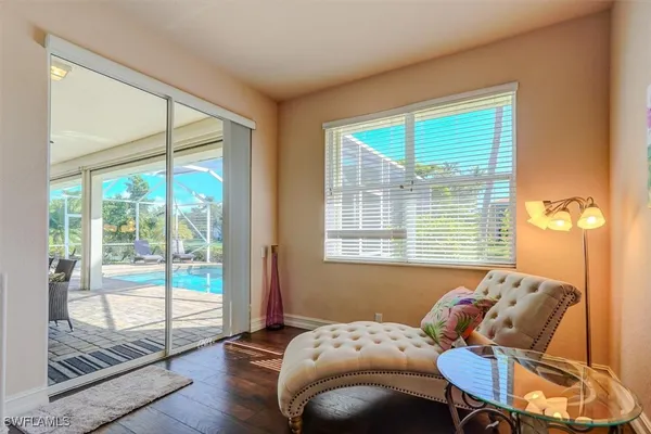 a bedroom with a bed and glass door
