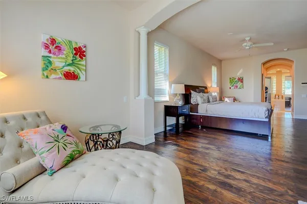 a bedroom with bed and a window