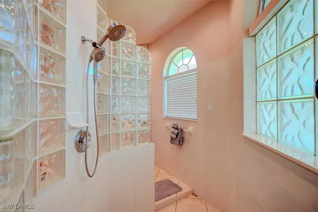 a bathroom with a bathtub and shower
