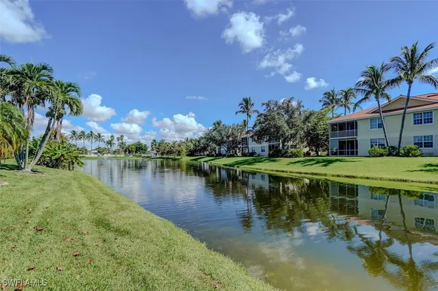 a view of a lake with a building in the background