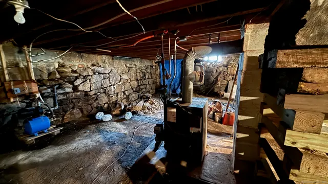 a view of a street with wooden fence