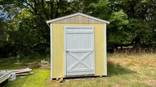 a view of swimming pool with a yard