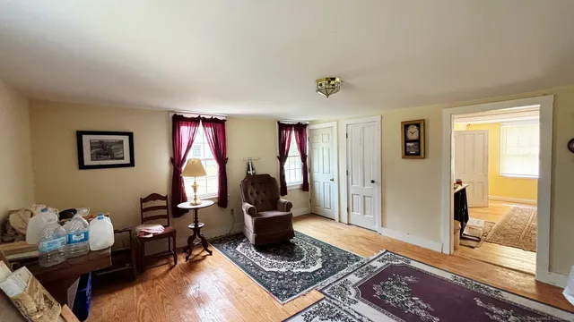 a living room with furniture rug and window