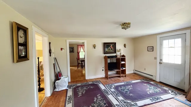 a living room with a couch and a window