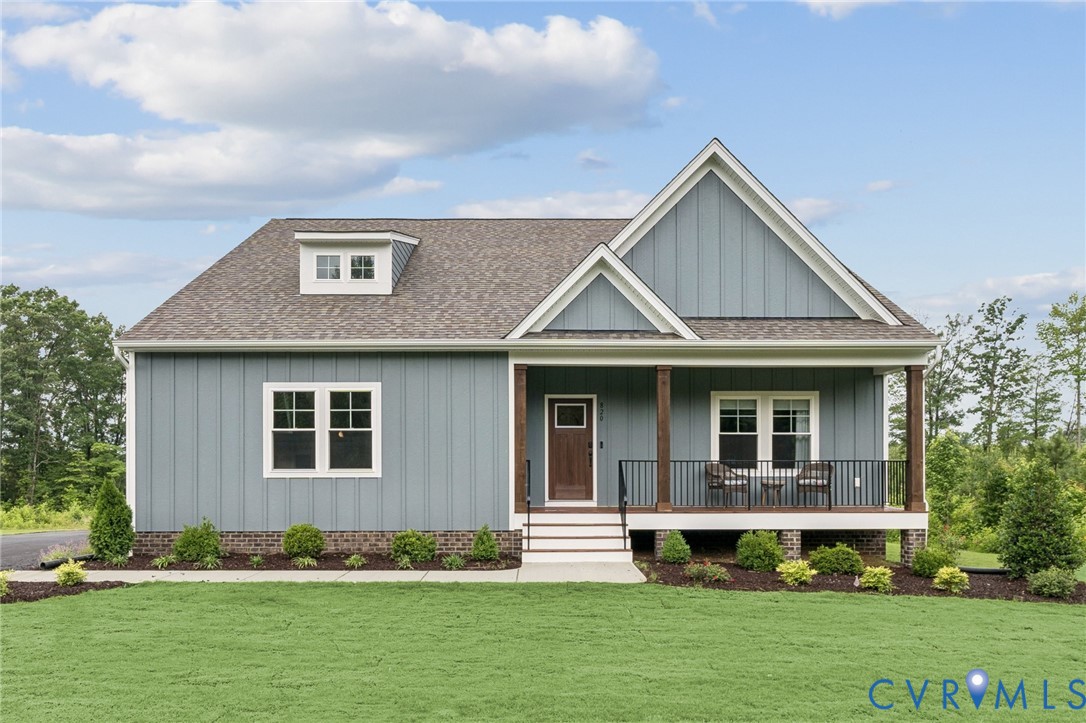 Randolph (Farmhouse) plan with side-load garage. D