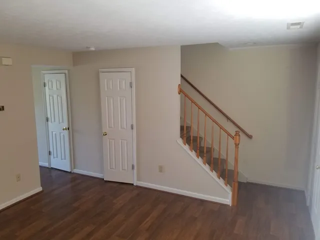 a view of an entryway with wooden floor