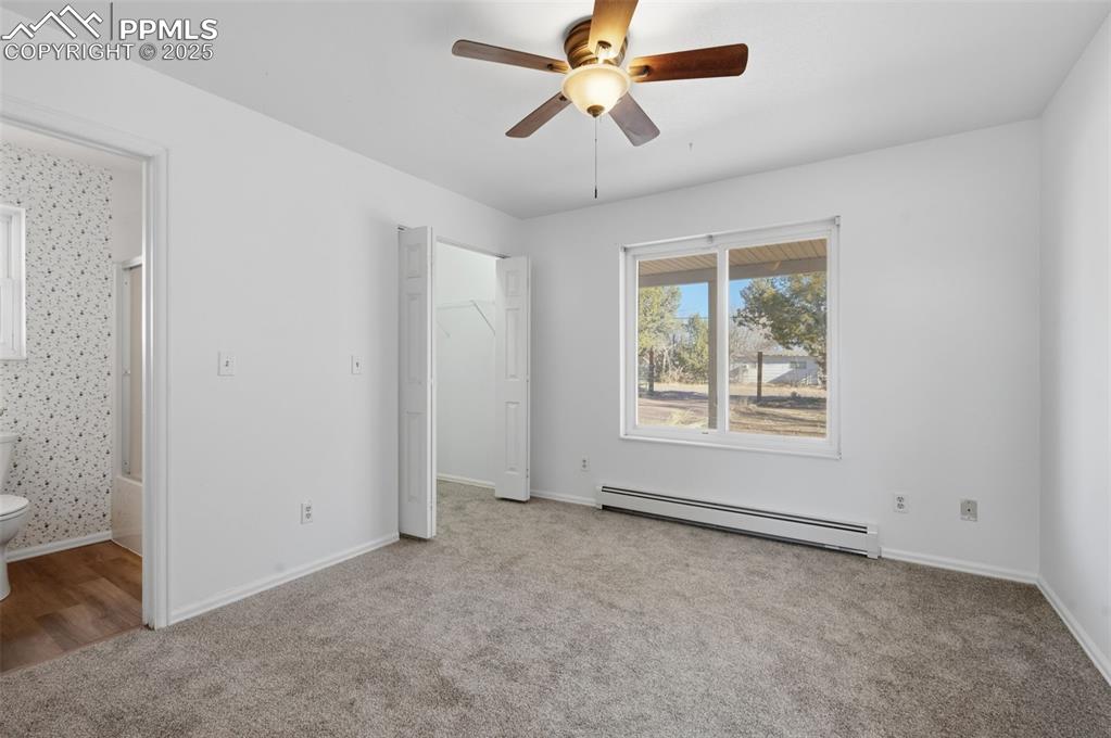 747 D Street Penrose, CO 81240 - Photo 20 of 36 an empty room with windows and fan