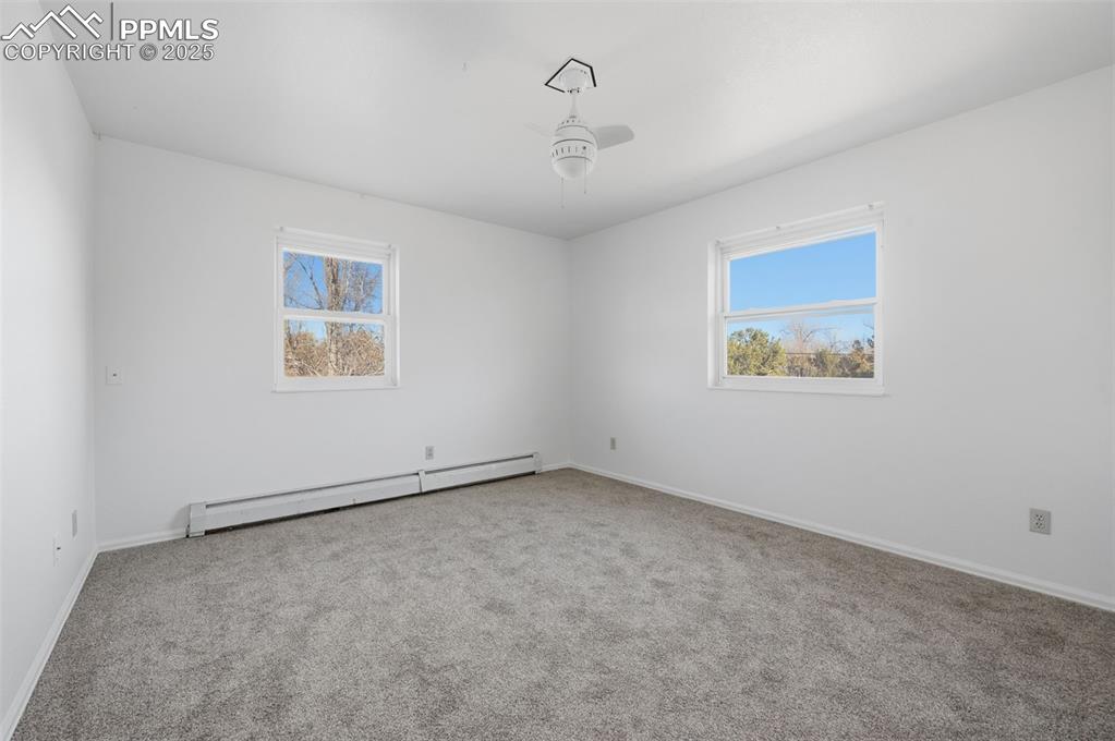 747 D Street Penrose, CO 81240 - Photo 25 of 36 an empty room with a painting on the wall