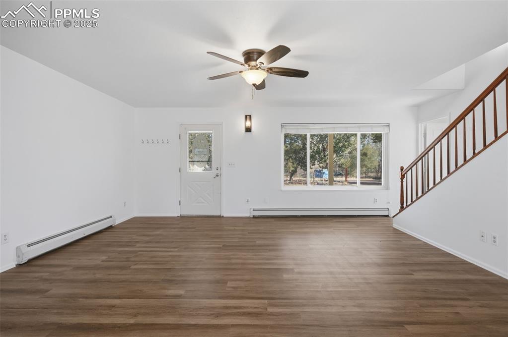 747 D Street Penrose, CO 81240 - Photo 9 of 36 a view of an empty room with wooden floor and a window