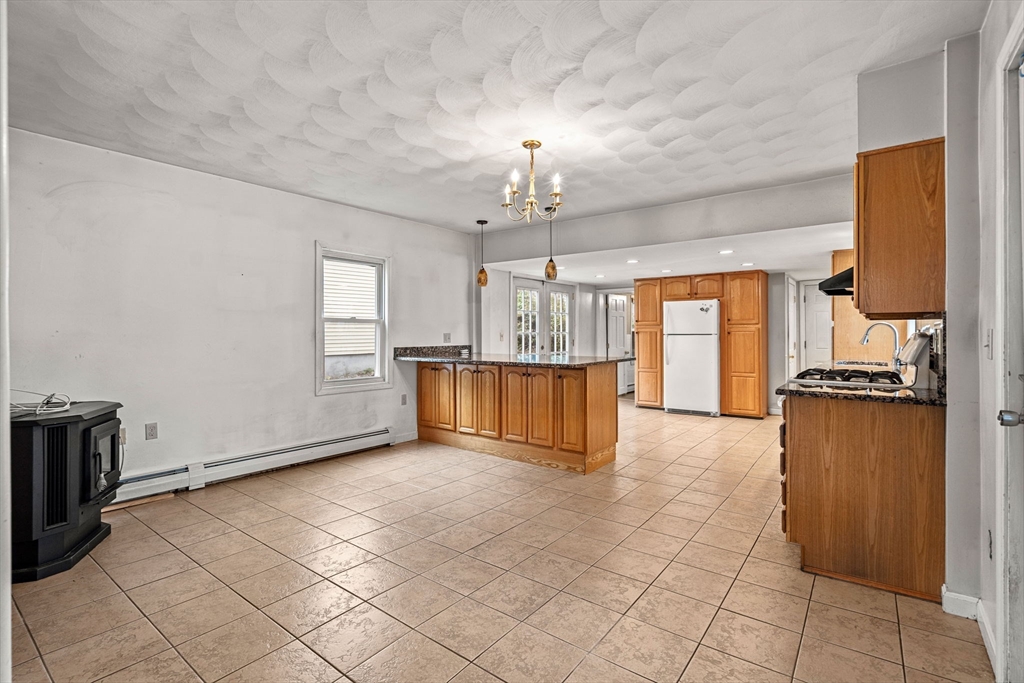 26 Elm Peabody, MA 01960 - Photo 11 of 41 a view of a kitchen with a sink and a refrigerator