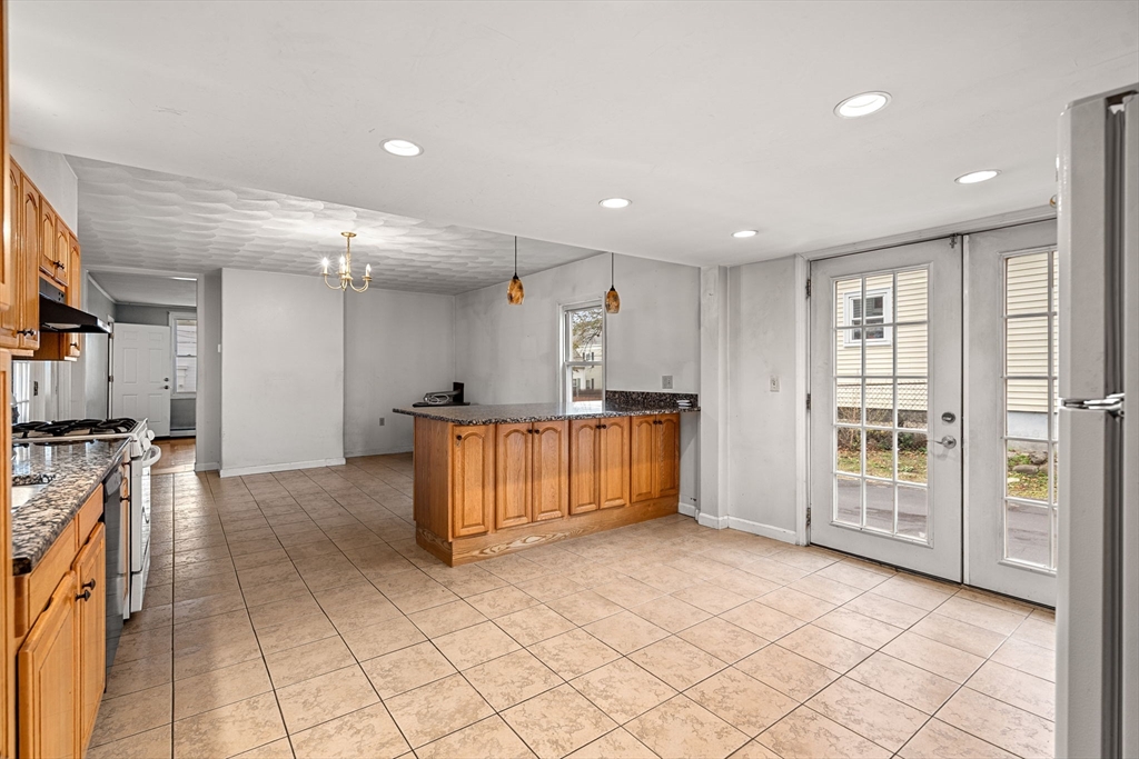 26 Elm Peabody, MA 01960 - Photo 16 of 41 a view of a kitchen with furniture and a refrigerator