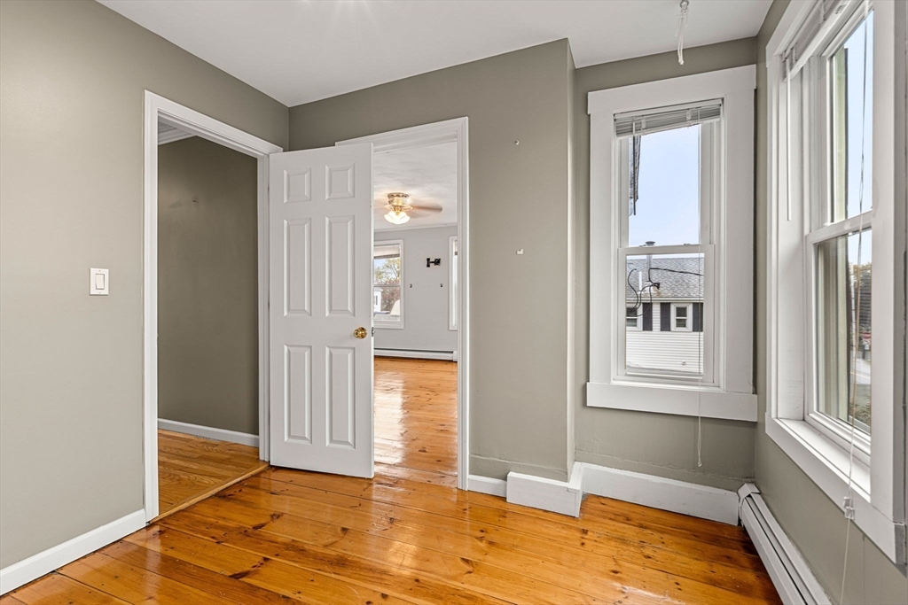 26 Elm Peabody, MA 01960 - Photo 29 of 41 a view of an empty room with wooden floor and a window