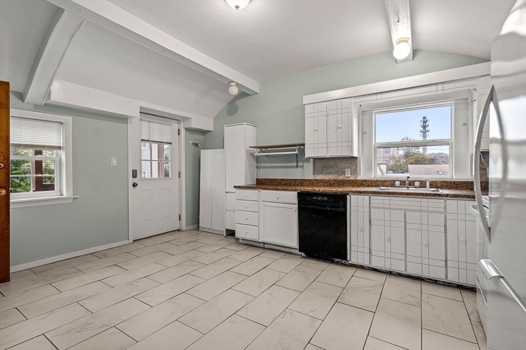 26 Elm Peabody, MA 01960 - Photo 35 of 41 a kitchen with a sink and a stove top oven