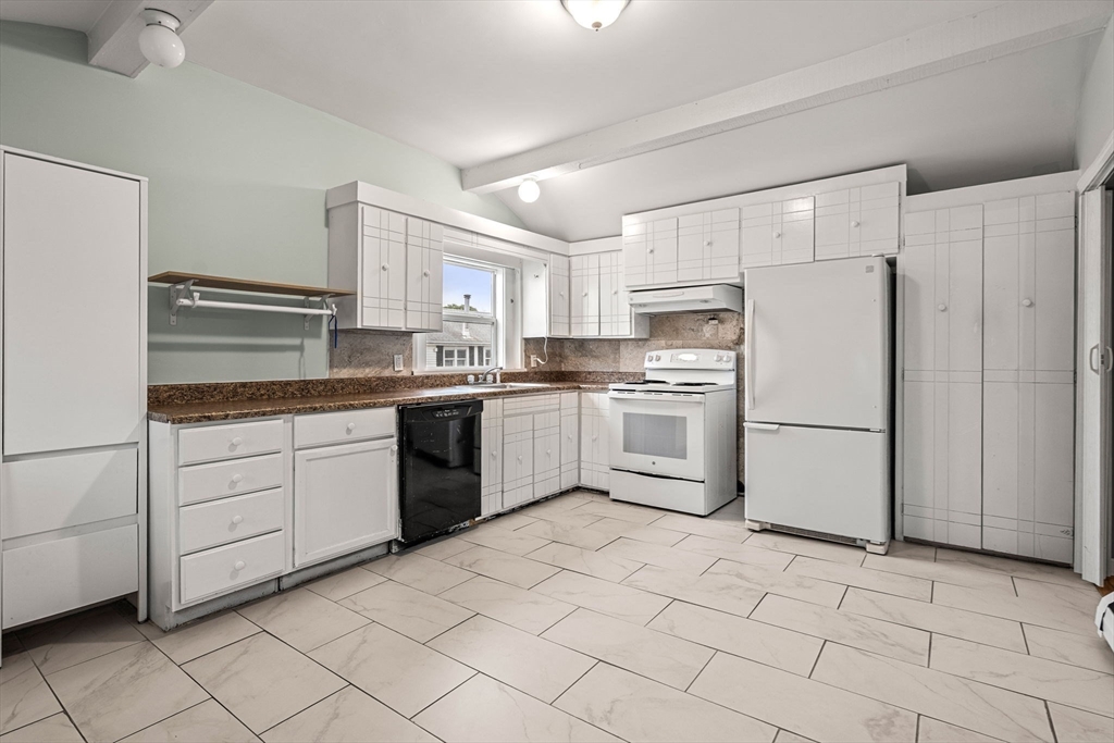 26 Elm Peabody, MA 01960 - Photo 36 of 41 a kitchen with white cabinets stainless steel appliances and sink