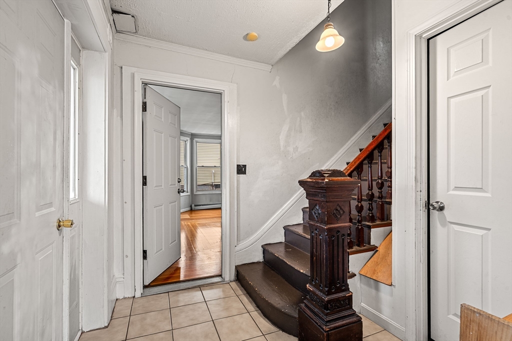 26 Elm Peabody, MA 01960 - Photo 7 of 41 a view of an entryway with staircase