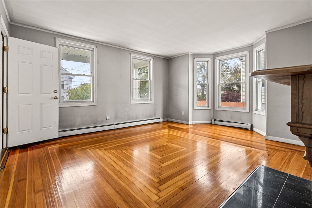 26 Elm Peabody, MA 01960 - Photo 10 of 41 a view of an empty room with window and wooden floor