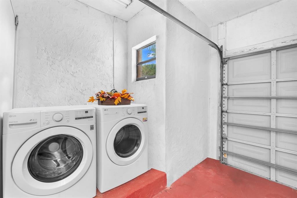 22710 Meridiana Drive Boca Raton, FL 33433 - Photo 22 of 39 a utility room with dryer and washer