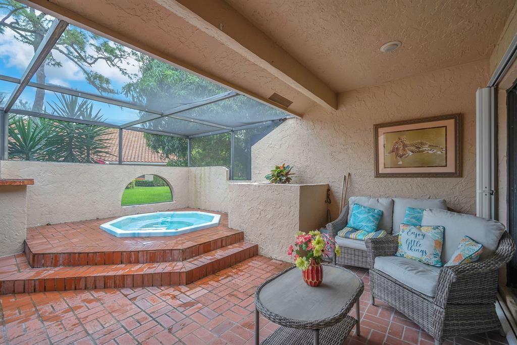 22710 Meridiana Drive Boca Raton, FL 33433 - Photo 25 of 39 a living room with furniture and a table