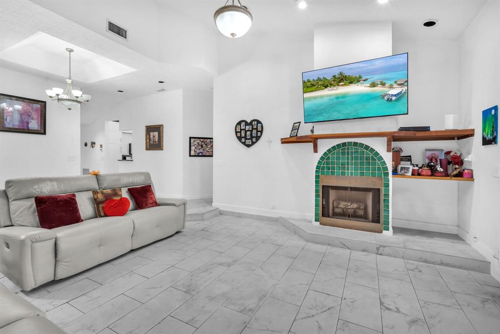 22710 Meridiana Drive Boca Raton, FL 33433 - Photo 3 of 39 a living room with furniture and a flat screen tv