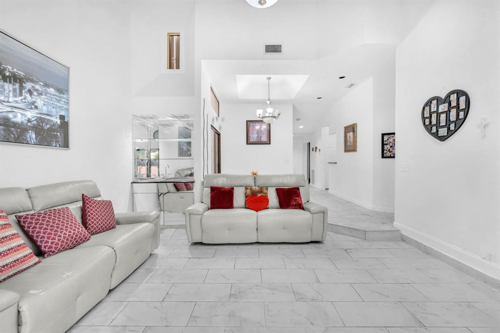 22710 Meridiana Drive Boca Raton, FL 33433 - Photo 4 of 39 a living room with furniture and a couch