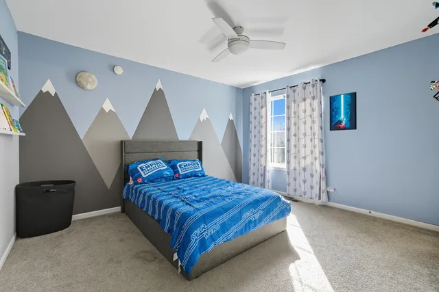 a bedroom with a bed and a cabinets