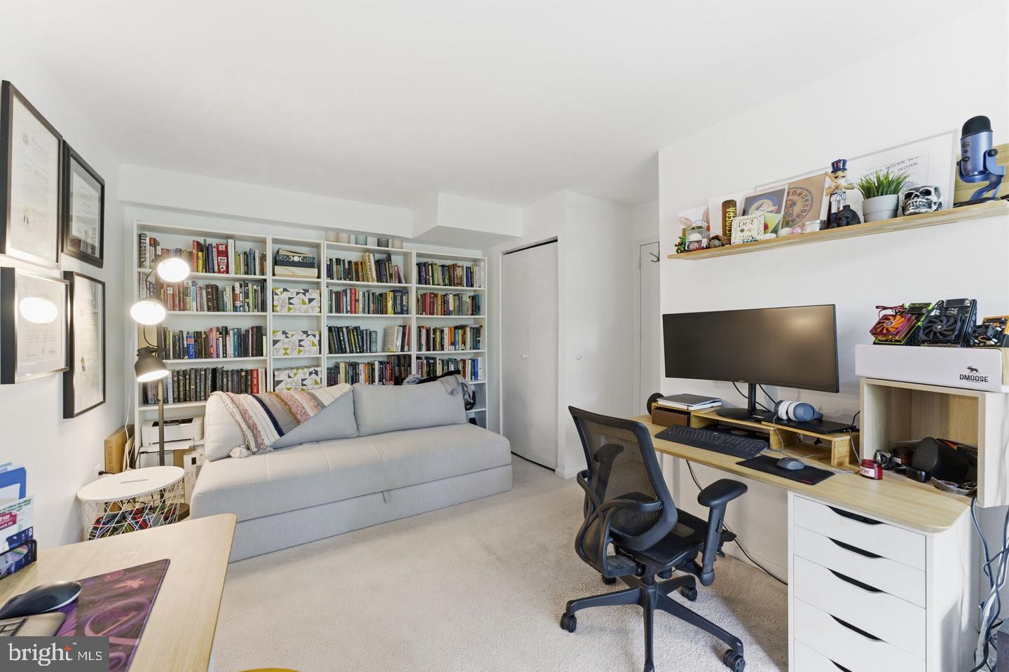 11260 Chestnut Grove Square, Unit 337 Reston, VA 20190 - Photo 36 of 82 Cozy workspace with a book-filled wall.