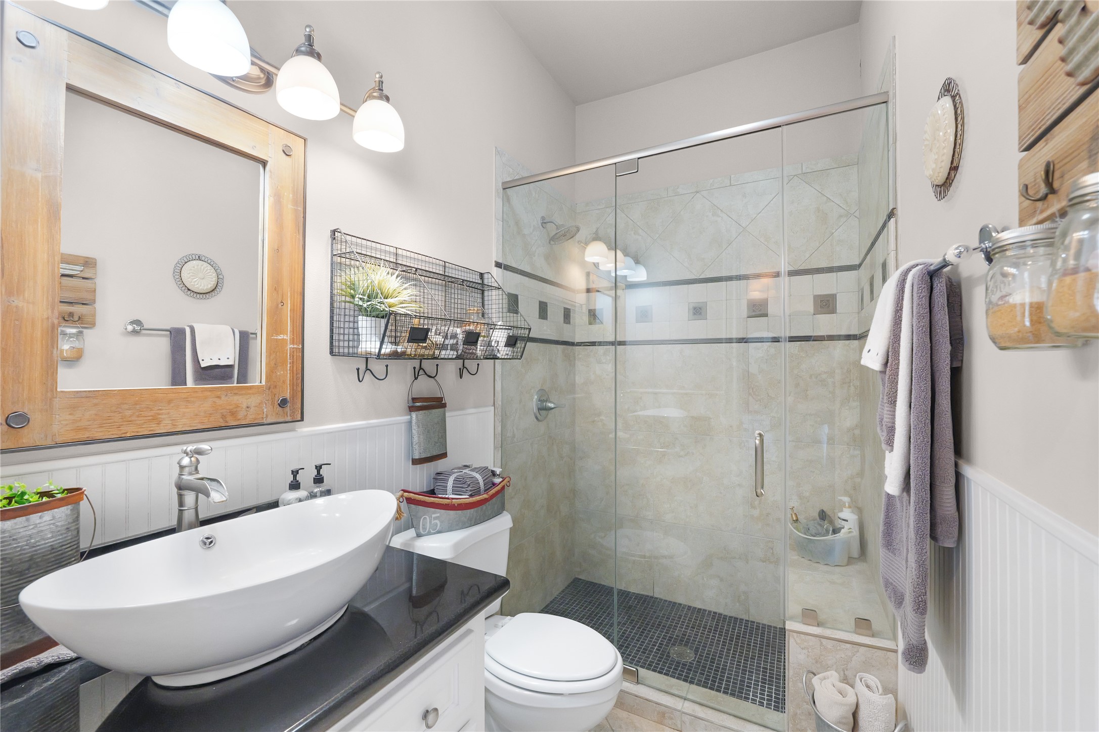 11 Lookout Ridge Huntsville, TX 77340 - Photo 16 of 45 a bathroom with a sink a toilet a mirror and shower
