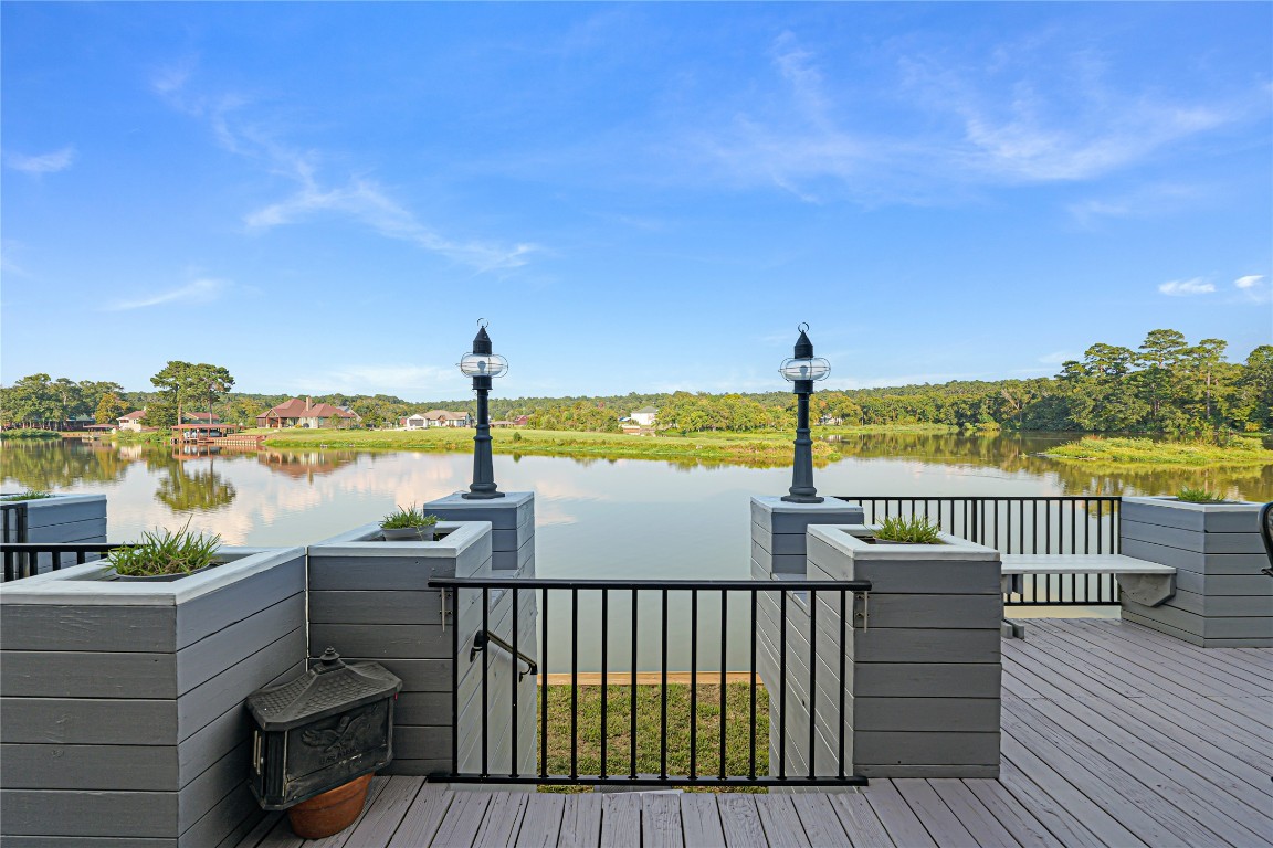 11 Lookout Ridge Huntsville, TX 77340 - Photo 44 of 45 a view of a balcony with wooden floor & fence